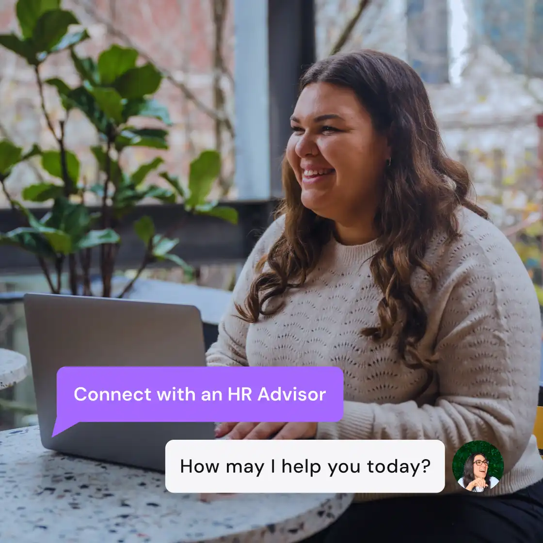 Smiling woman using a laptop indoors, with green plants and a city view behind her. Chat bubbles say, "Connect with an HR Advisor" and "How may I help you today?"